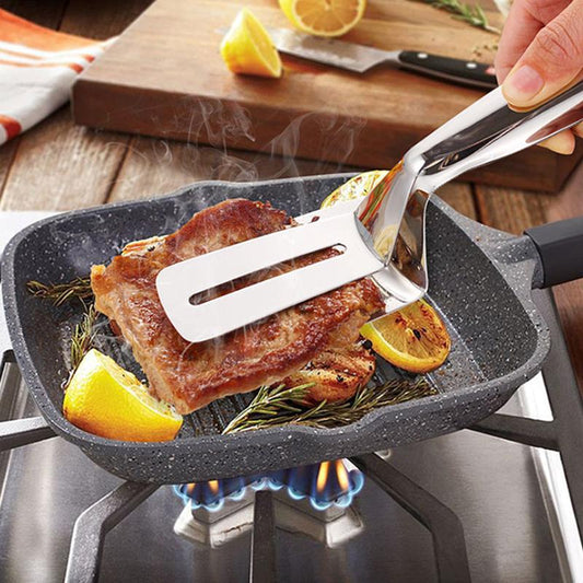 🍖🎁 50 % Rabatt🔥 Grillklämma i Rostfritt Stål 2-i-1 – stekspade & tång i ett – greppa, vänd och lyft med ett enda redskap ✨